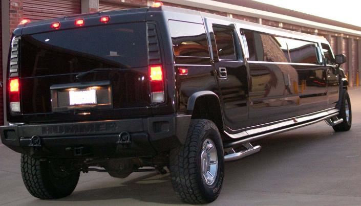 Rear photo of the black Stretch H2 Hummer